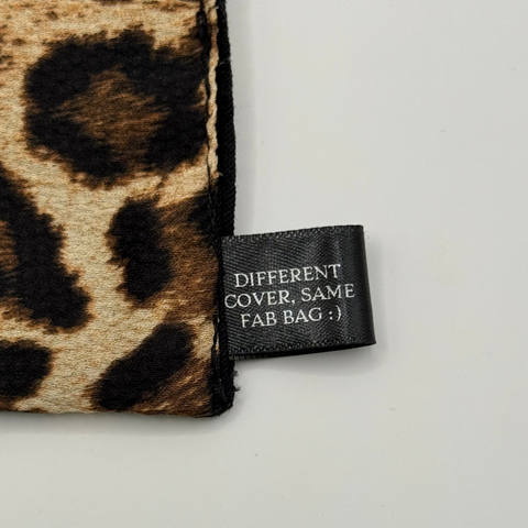 Leopard print cover with a label on a light gray background