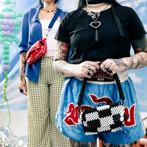 Two people standing side by side with colorful backgrounds