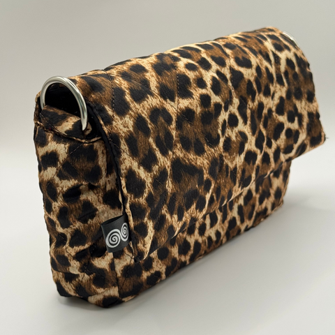 Leopard print clutch bag on a light gray background